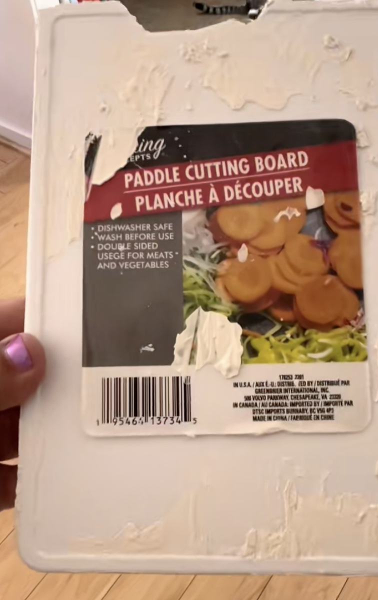 woman holding a cutting board